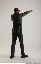 ERIC STANDING POSE WITH GUNS